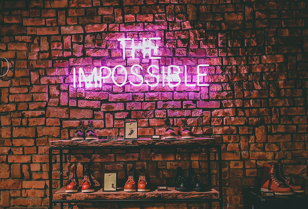The impossible neon sign on brick wall