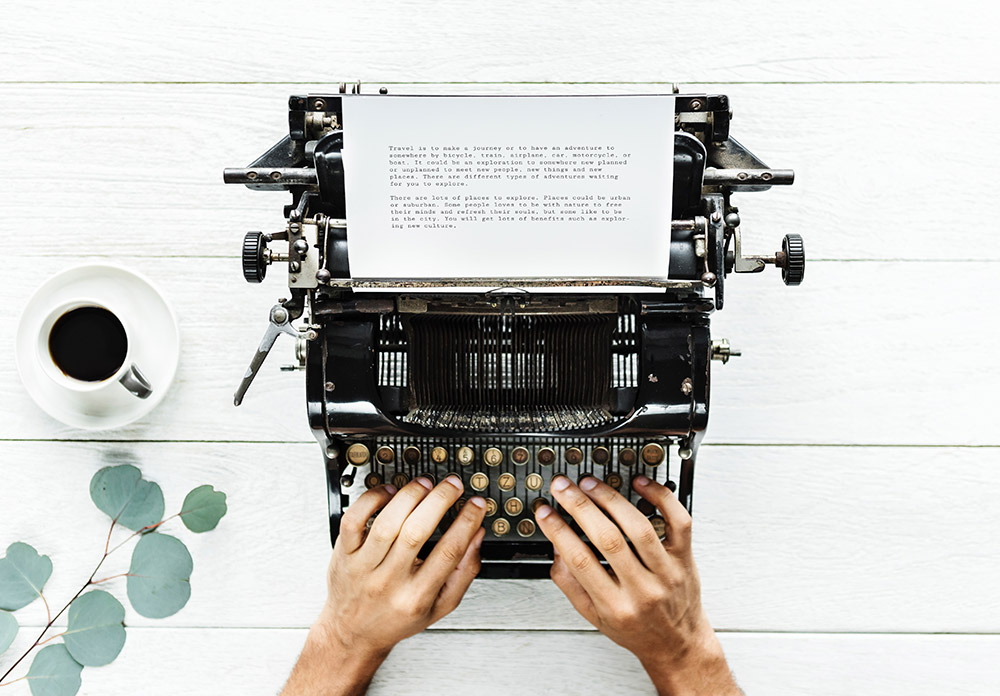 White typewriter and coffee